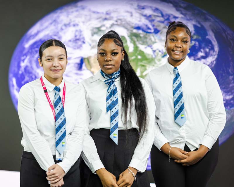 Travel tourism three female students in uniform