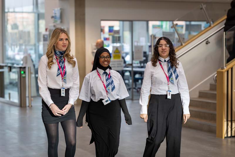 Travel tourism three female students walking