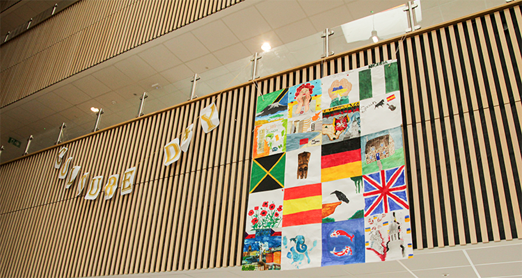 Hanging collage of various flags from around the world to celebrate Culture Day