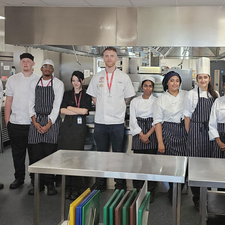 Professional Cookery & Hospitality students pictured as a group with Richmond upon Thames College alumnus during cheese workshop