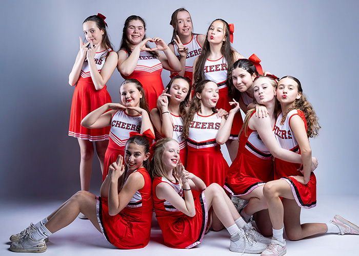 Dance troupe involved in the IGNITE Dance Festival - they are all wearing red and white cheerleading outfits
