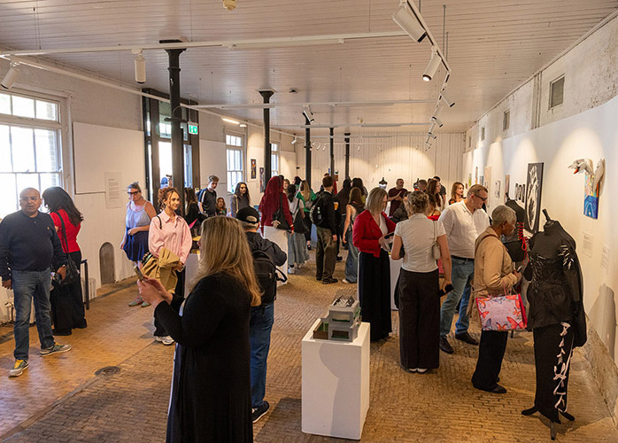 Orleans House Gallery Exhibition - people are mingling in the space and looking at the art and talking