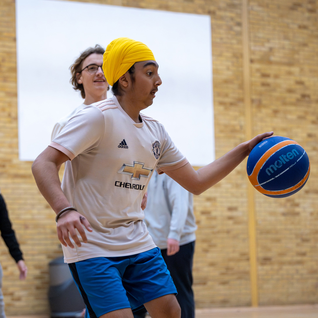 students playing basketball