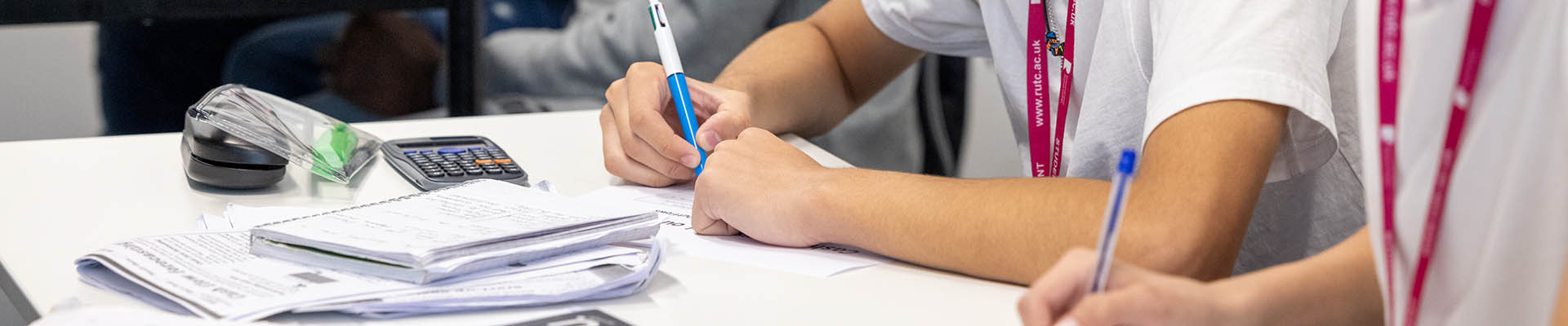 Two Richmond upon Thames Business students taking notes