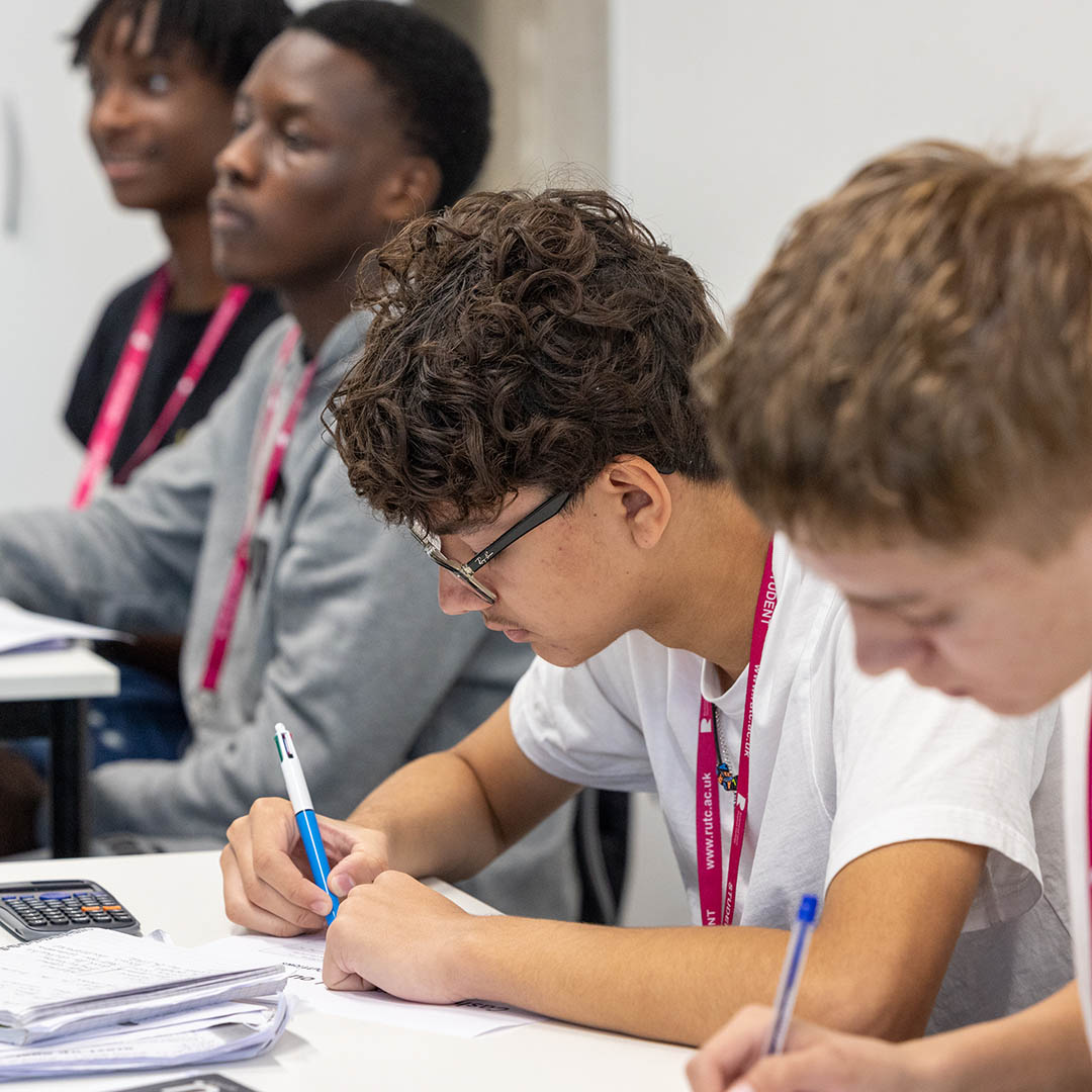 Two Richmond upon Thames Business students taking notes